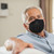 Older man wearing Versarien FFP2 Graphene Protective Reusable Face Mask Pack - featuring Nanane™ and Polygrene™